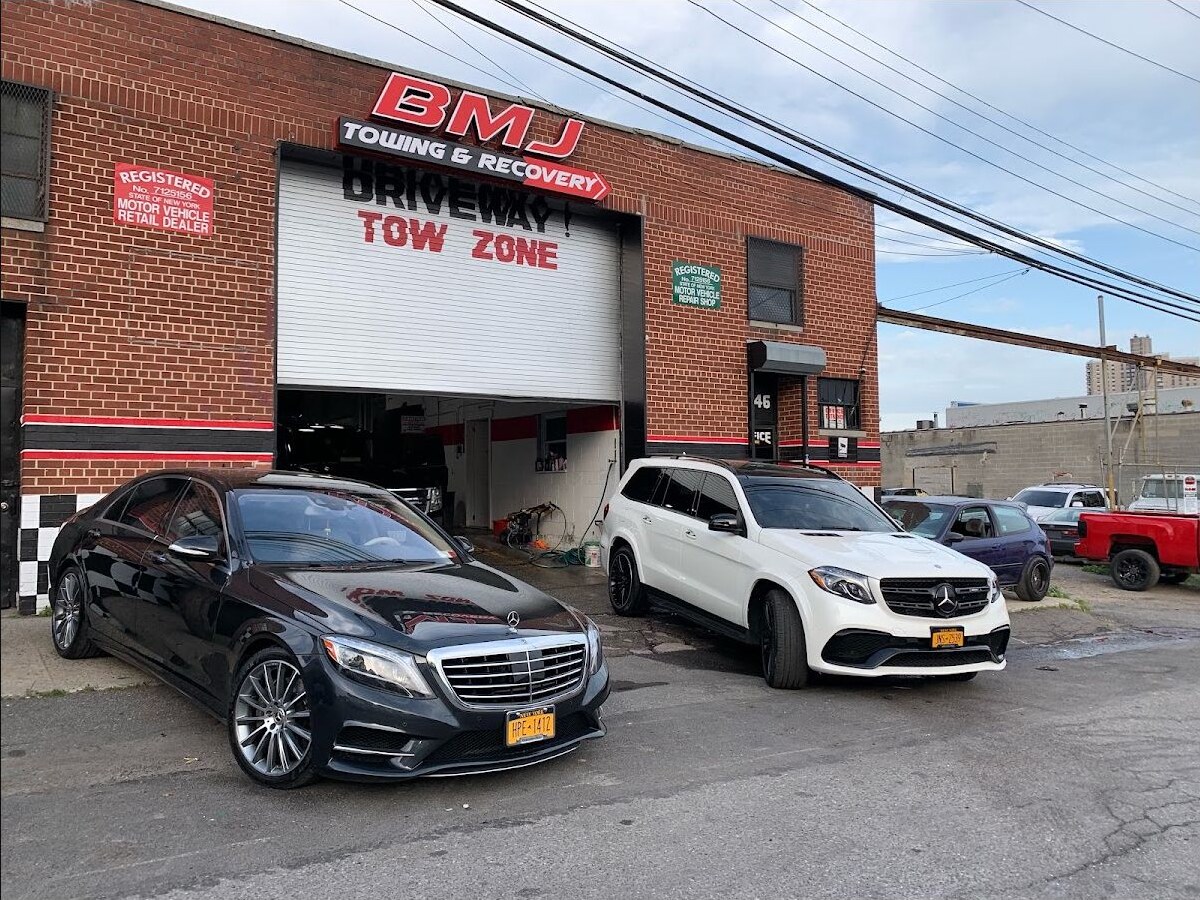 BMJ Auto Collision exterior with luxury vehicles