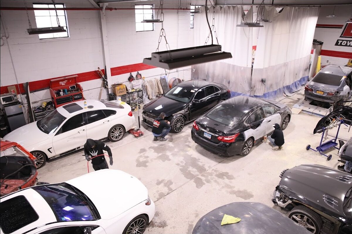 BMJ Auto Collision workshop with vehicles undergoing body repair